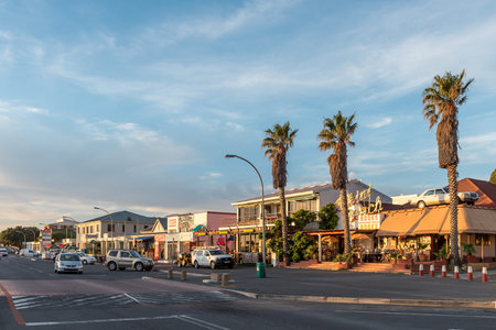 GORDONS BAY, SOUTH AFRICA - APRIL 12, 2021: Panoramic sunset street scene in Gordons Bay in the Western Cape Province. People and vehicles are visibleのeditorial素材