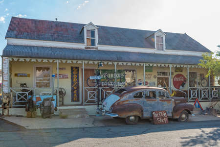 PRINCE ALBERT, SOUTH AFRICA - APRIL 20, 2021: A street scene, with The Olde Shoppe, an antique shop, in Prince Albert in the Western Cape Province. A vintage car is visibleのeditorial素材