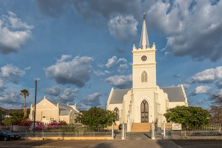 PRINCE ALBERT, SOUTH AFRICA - APRIL 21, 2021: An early morning street scene, with the Dutch Reformed...