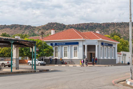 BURGERSDORP, SOUTH AFRICA - APRIL 22, 2021: A street scene, with a bank building, people and vehicles, in Burgersdorp in the Eastern Cape Provinceのeditorial素材