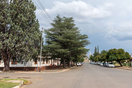 BURGERSDORP, SOUTH AFRICA - APRIL 22, 2021: A street scene, with the Dutch Reformed Church in Burgersdorp in the Eastern Cape Province. Buildings,  people and vehicles are visibleのeditorial素材