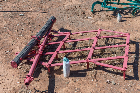 A historic spike harrow. It was pulled by a donkey or mule