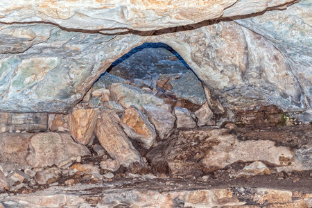 The trail through the narrow Wolfberg Crack passes through a small hole in the rocksの写真素材