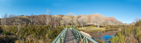 KROMRIVIER, SOUTH AFRICA - SEP 5, 2022: Panoramic view of the area around the pedestrian bridge over the Krom River at Kromrivier Cederberg Parkのeditorial素材