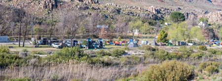SANDDRIF, SOUTH AFRICA - SEP 7, 2022: Panoramic view of the camp site at Sanddrif in the Western Cape Cederberg. Tents and vehicles are visibleのeditorial素材