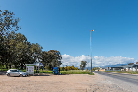 Somerset West, South Africa - Sep 19, 2022: A street scene in Main Road in Somerset West in the Western Cape Province. Two mobile kiosks and vehicles are visibleのeditorial素材