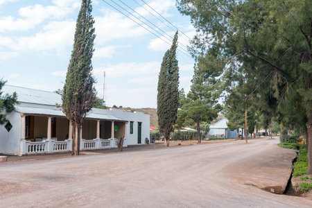 LOXTON, SOUTH AFRICA - SEP 2, 2022: A gravel street scene, with historic houses, in Loxton in the...