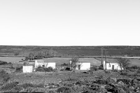 Sutherland, South Africa - Sep 4, 2022: Farm worker houses at Kanolfontein farm on the Bo-Visrivier road near Sutherland in the Northern Cape Province. Monochromeのeditorial素材