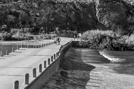 Sanddrif, South Africa - Sep 7, 2022: Road bridge over the Matjies River at Sanddrif in the Western Cape Cederberg. People are visible. Monochromeのeditorial素材