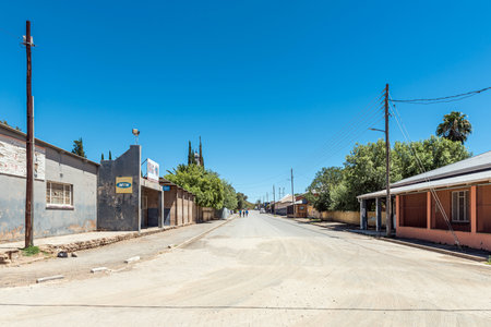 Petrusville, South Africa - Feb 21, 2023: A street scene, with buildings, people and vehicles, in Petrusville in the Northern Cape Provinceのeditorial素材