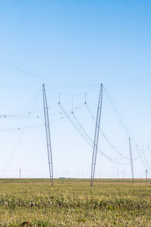 A power transmission route with guyed cross-rope suspension pylons near Jagersfontein in the Free State Provinceの写真素材