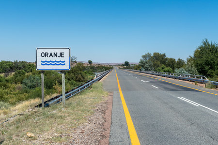 Bridge on road N8 over the Orange River at Groblershoop in the Northern Cape province. The river is in floodの写真素材