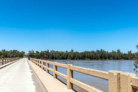 The road bridge over a flooded Orange River at Grootdrink in the Northern Cape Provinceの写真素材