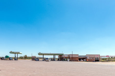 Groblershoop, South Africa - Feb 24, 2023: A gas station, tyre shop and restaurant, in Groblershoop in the Northern Cape Provinceのeditorial素材