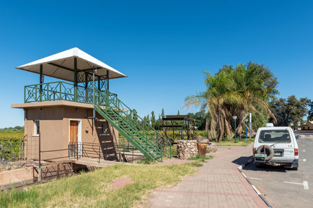 Keimoes, South Africa - Feb 25, 2023: A viewpoint, irrigation canal, waterwheel and a vehicle, in Keimoes in the Northern Cape Provinceのeditorial素材