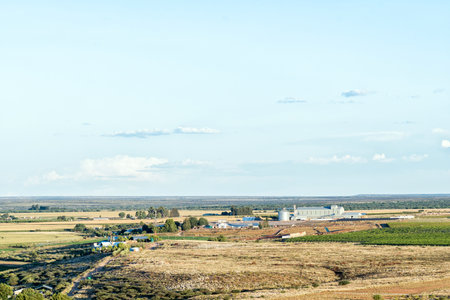 Prieska, South Africa - Feb 28 2023: Farm buildings and the factory of Oranjeriviervoere as seen from The Koppie Nature Reserve in Prieska in the Northern Cape Provinceのeditorial素材