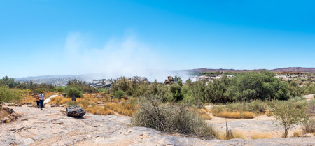 Augrabies National Park, South Africa - Feb 25, 2023: Tourists on a footpath from the main viewpoint to the restaurant at the Augrabies waterfallsのeditorial素材