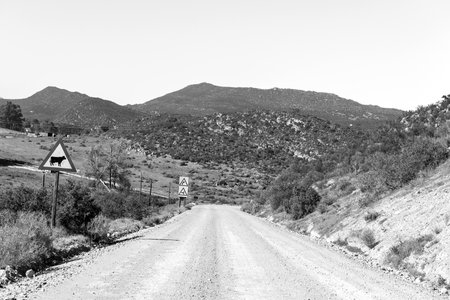 Southern end of the Nieuwoudt Pass in the Western Cape Cederberg. Road signs are visible. Monochromeの写真素材