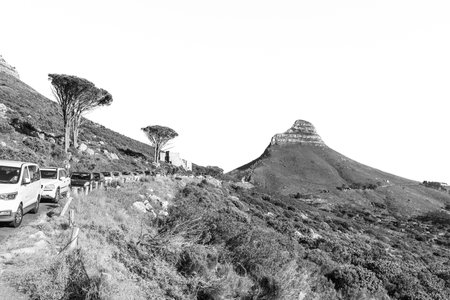 Cape Town, South Africa - Sep 14, 2022: Lions Head, the lower cable station and parked cars on the slope of Table Mountain in Cape Town. Monochromeのeditorial素材
