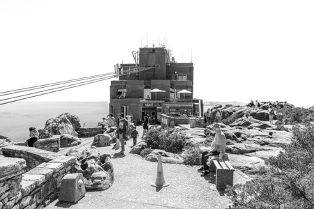 Cape Town, South Africa - Sep 14, 2022: The top cable station of the Table Mountain cableway in Cape Town. Tourists are visible. Monochromeのeditorial素材