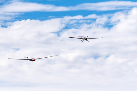 Bloemfontein, South Africa - May 20, 2023: A UFM-13 Lambada towing a Janus B glider at the Tempe Airport in Bloemfonteinのeditorial素材