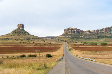 Landscape on road R26 between Ficksburg and Fouriesburg. Sandstone hills and agriculture fields are visibleの写真素材