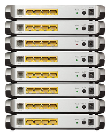 Stack of eight ADSL modems, isolated on white with 