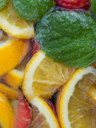 Closeup of Punch Cocktail with Fruit and Mint Leavesの写真素材
