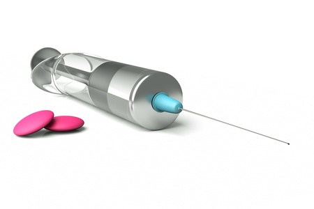 a  syringe with pills on whiteの写真素材