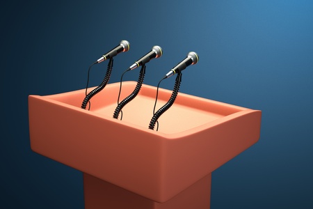 a  podium with microphonesの写真素材