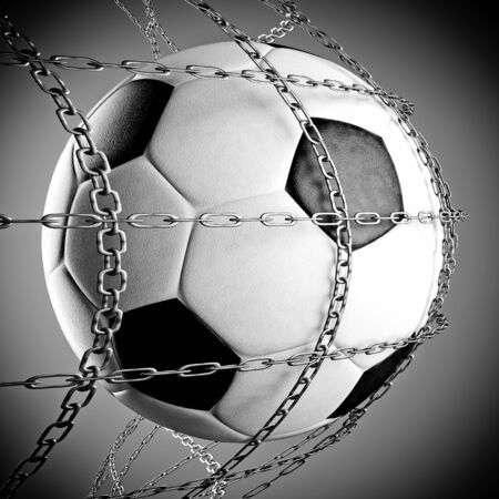 a soccer ball in a chain net, goal conceptの写真素材