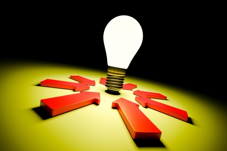 a glowing bulb in a darkness with arrowsの写真素材