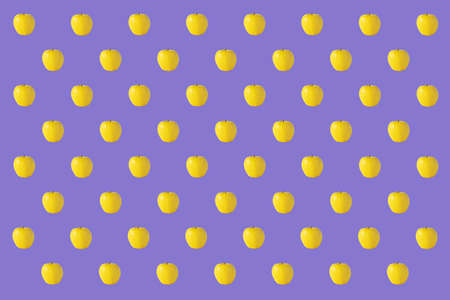 Pattern of yellow apples on a purple backgroundの写真素材