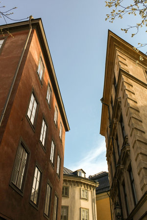 Two irregularly shaped house in the center of Stockholm in the autumn against the sky.の写真素材