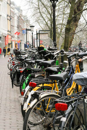 Lots of of colorful bicycles parked in the historical center of the European town.の写真素材