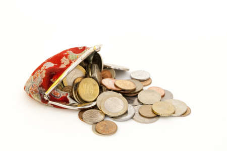 Old fashioned red purse with flowers, and coins.の写真素材