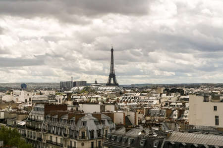 Panoramic view of Paris. Roofs of houses, the Grand Palace and the Eiffel Tower.のeditorial素材