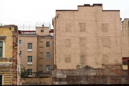 Traces of a ruined house on the wall of a neighboring house.の写真素材