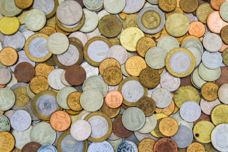 Background from a variety of coins from different countries.の写真素材