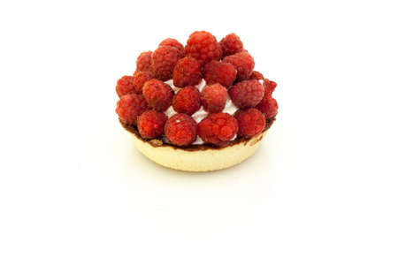 Tartlet pastry with cream and fresh raspberries on white background.の写真素材