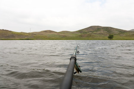Lake, green hills and old fishing tackle.