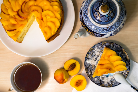 Peach cake flat lay top view tea setの写真素材