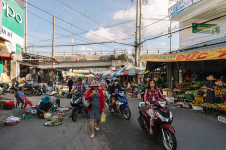 DUONG DONG, PHU QUOC, VIETNAM - NOVEMBER 13, 2017: Local day market street. Sellers sell products...