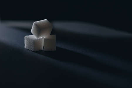 White refined cubes sugar on darkの写真素材