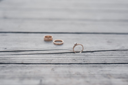 wedding rings bride and groom on the wooden background. Wedding ceremony. Jewelry.