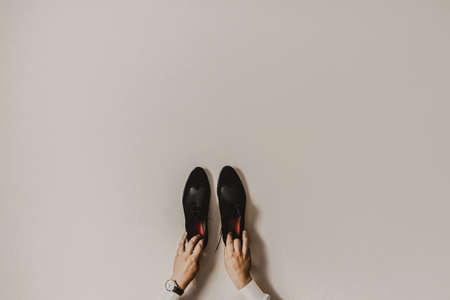 Men classic fashion formal black shoes. accessories are laid out near mens shoesの写真素材