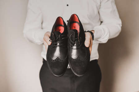 Men classic fashion formal black shoes. accessories are laid out near mens shoesの写真素材
