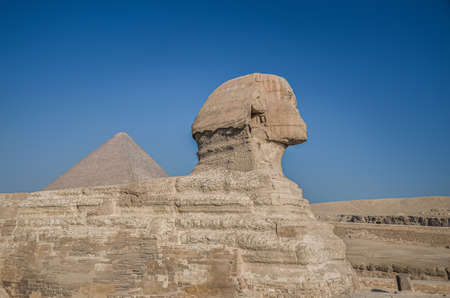 Egyptian Sphinx. Ancient Egyptian Ruins and Pyramids. The sandy desert in Cairo.の写真素材