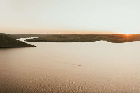 Islands in middle of the sea at sunsetの写真素材