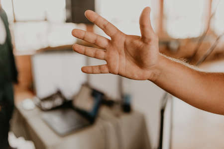 Human male hand with the inner side. A hand outstretched to someone.の写真素材
